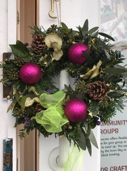 This image has an empty alt attribute; its file name is website-pic-wreath-purple.jpg